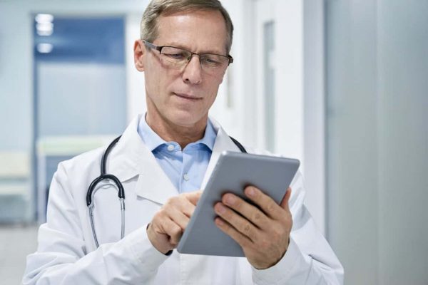 doctor with tablet